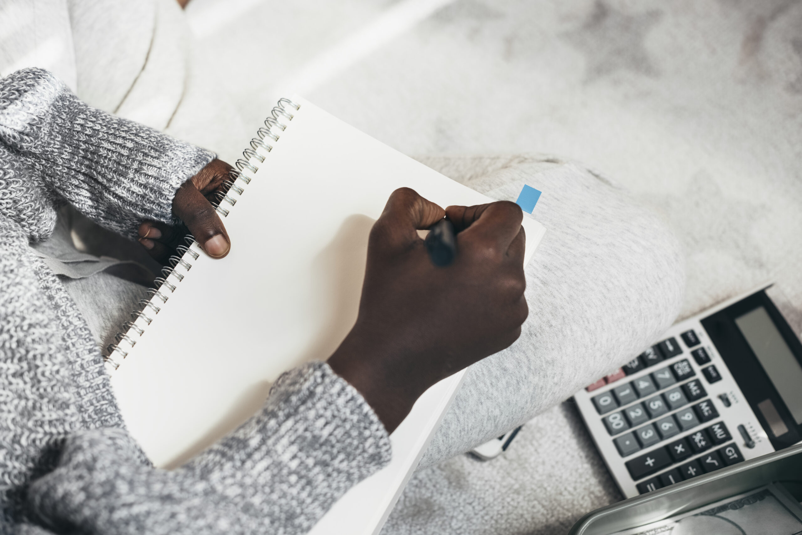 Writing on a blank notebook